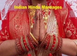 Indian Hindu Marriages | 7 Important Marriage Rituals A person in traditional Indian attire with hands in a Namaste gesture, wearing ornate red bangles and a sari. The text reads, "Indian Hindu Marriages" and "Think Must.