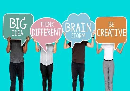 A group of people holding up speech bubbles that say big brain, attempting to change the way of thinking.