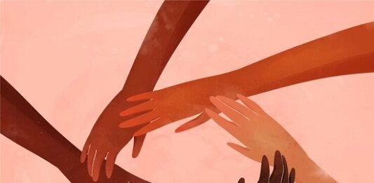 A group of hands forming a circle, symbolizing unity and connection, on a pink background. Saying life and injustice