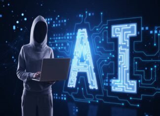What Are AI Agents and How Do They Work? A person in a hoodie using a laptop stands next to a large digital AI sign, illuminated with circuit patterns, amidst the intriguing world of AI agents on a dark tech-themed background.